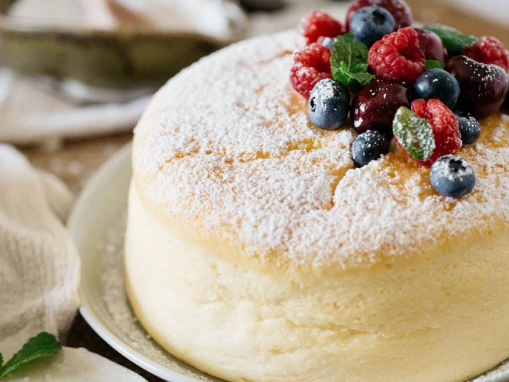 Giggly Japanese cheesecake decorated with berries on top